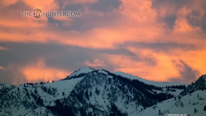 Sunset over the snow covered mountains