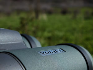 Close up of the Vortex name on the side of Vortex Razor HD 10x42 binoculars.