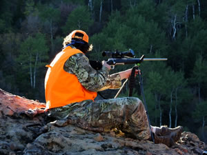 Dallen sitting on cliff elk hunting with X-Bolt